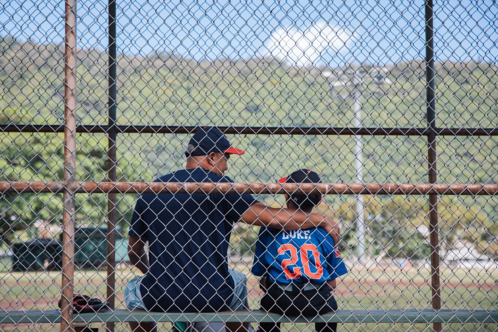 Kendal and his son at the ballpark